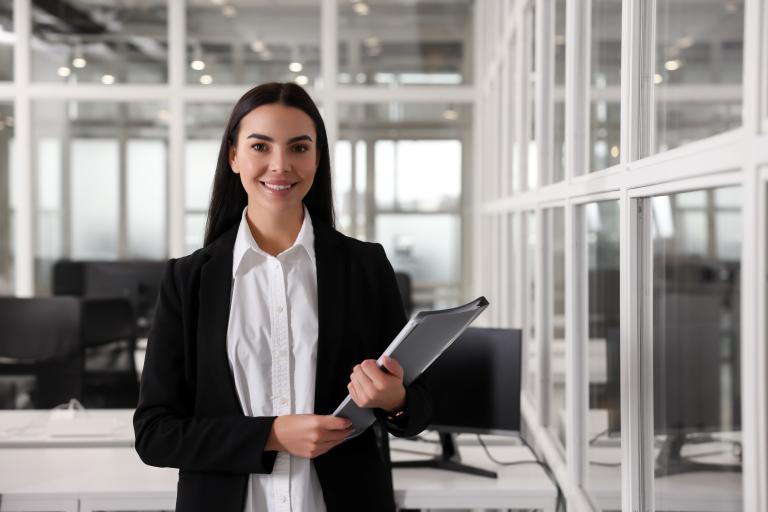 Woman carrying notebook